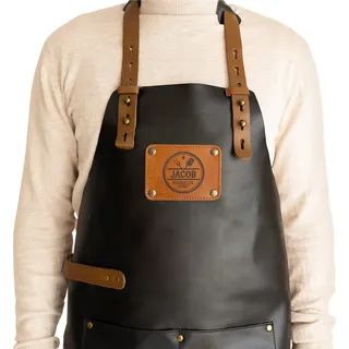 your surprise Lederschürze personalisiert - Grillschürze für Männer und Frauen personalisierbar mit Namen, Geschenk für Grill- / Kochbegeisterte (Schwarz) - 95.5-125.5 cm