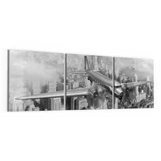 DEQORI Glasbilder Echtglas | Motiv Flugzeug über Stadt | horizontal 3-teilig 150x50 cm | große XXL Deko | Wandbilder für Wohnzimmer, Schlafzimmer, Flur & Küche | moderne Wanddeko