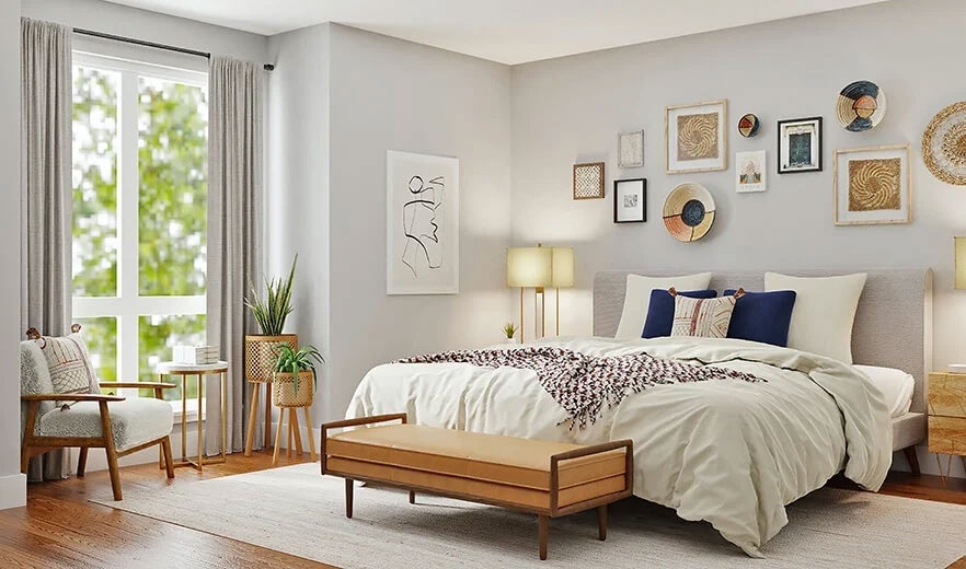 Modernes Schlafzimmer mit Doppelbett, Sessel und Bildern
