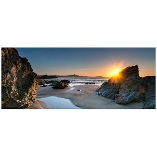Wallario Glasbild, Sonnenuntergang hinter einem Felsen am Strand, in verschiedenen Ausführungen blau
